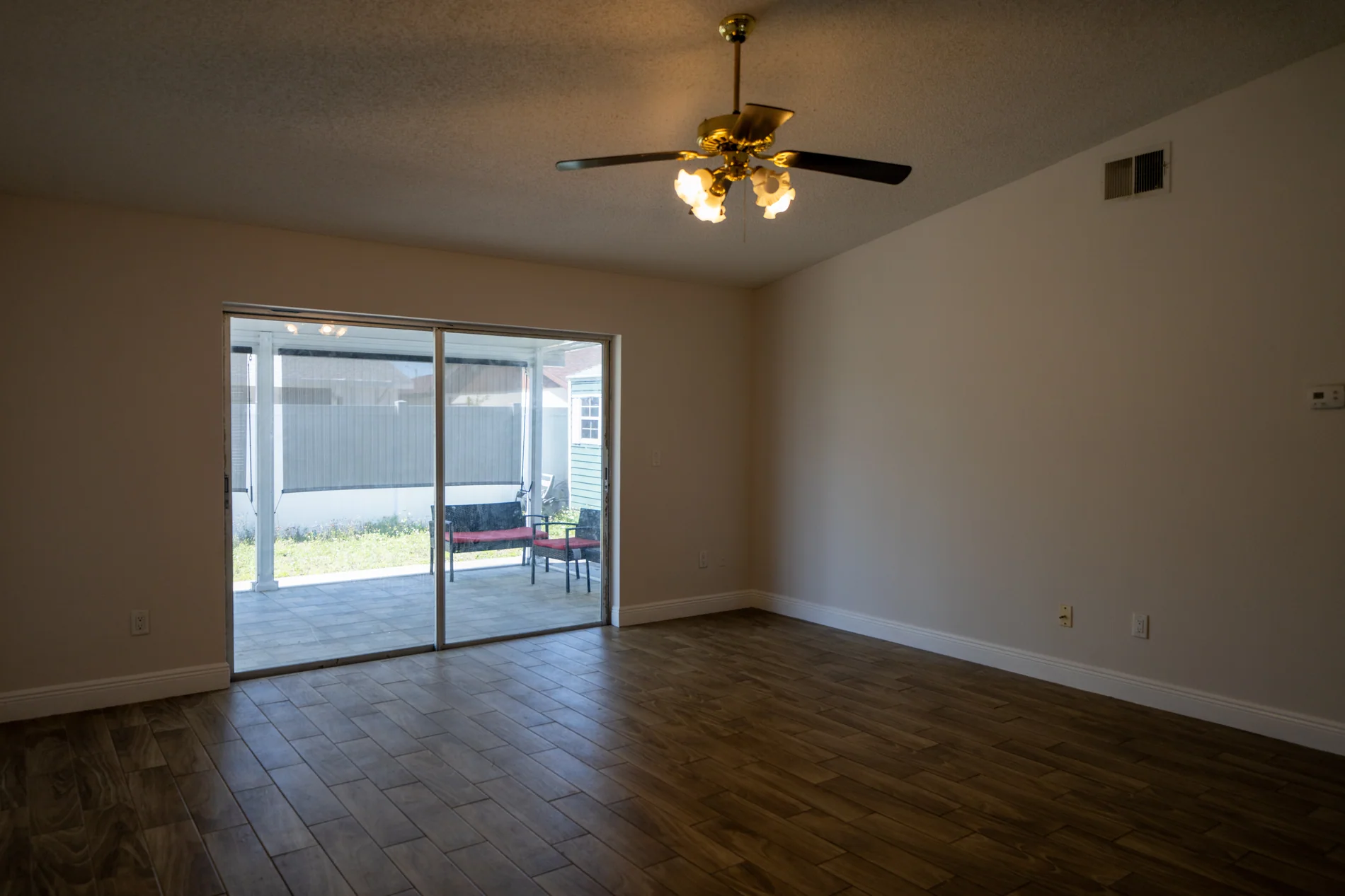 Open living room with natural light and patio access