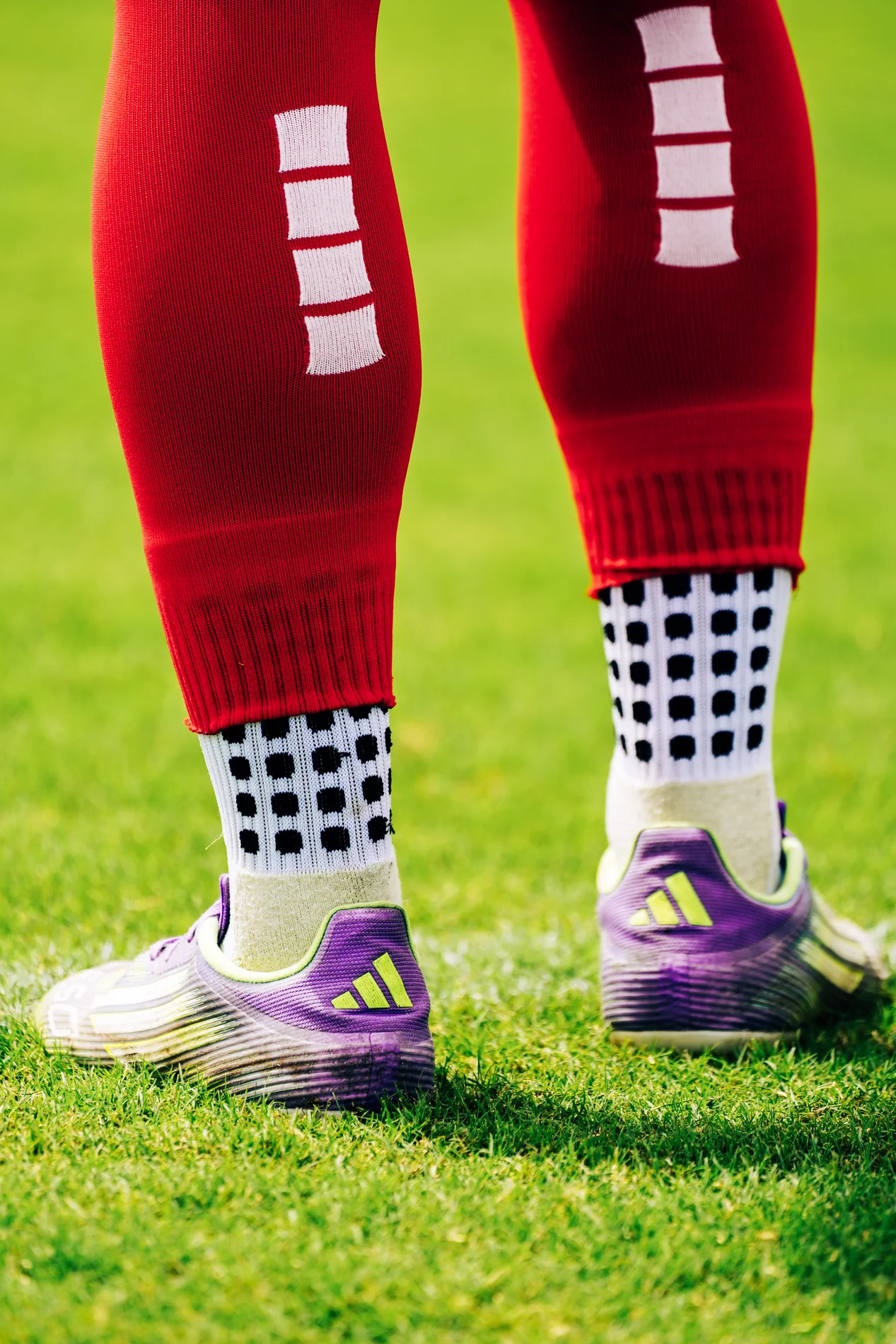 Red soccer socks and cleats before a match